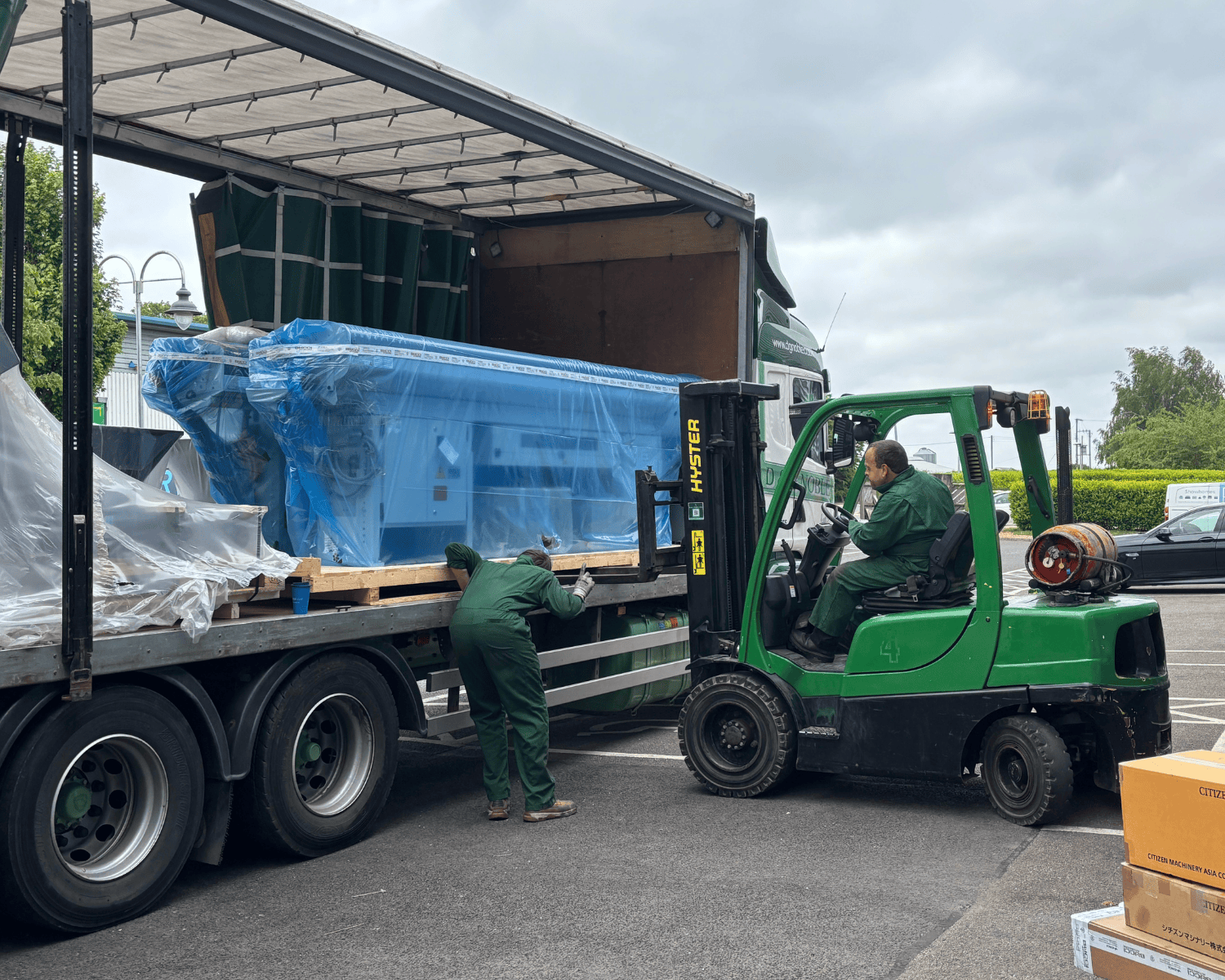Cincom Citizen Machinery L12-VII LFV and L20-VIII LFV CNC turning centers being offloaded from delivery truck at First Light Lamps UK facility